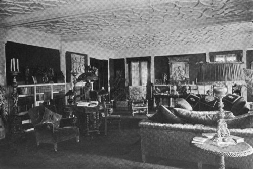 A photograph inside the living room, taken circa June, 1907.