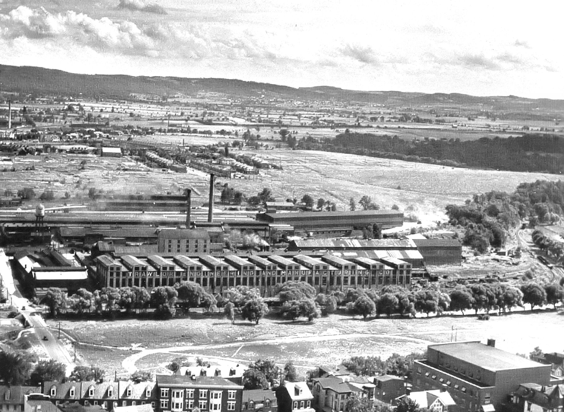 Black and white aerial photo of the mill complex.